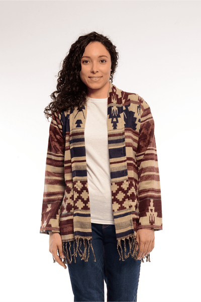 Woman wearing aztec inspired boho sweater.