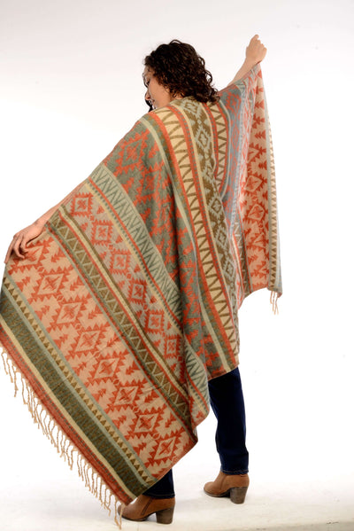 Woman wearing aztec Jaipur Scarf, get you through chilly evenings around the fire